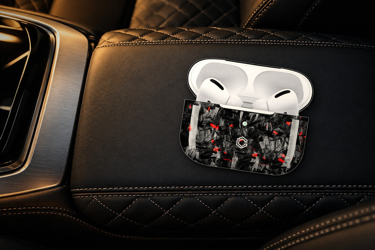 Carboluxe forged carbon AirPods case in a luxury car