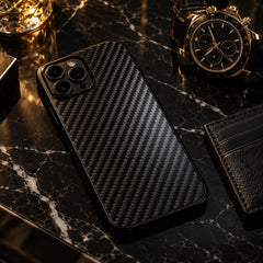 Carboluxe carbon fiber iPhone case on black marble with a luxury watch