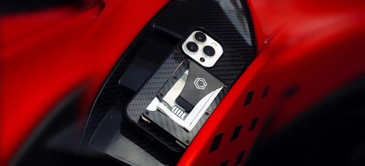 Carboluxe carbon fiber case with slim wallet on a red car