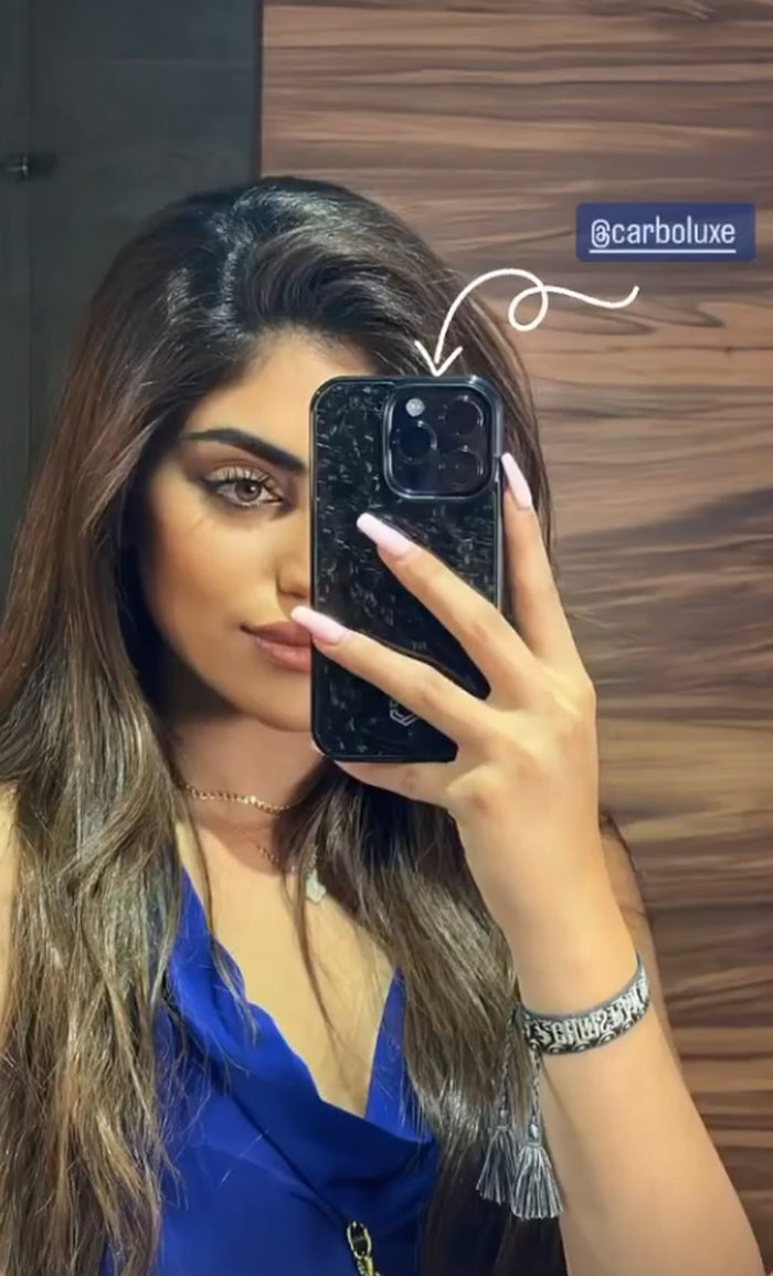 Customer taking a mirror selfie with a Carboluxe forged carbon phone case